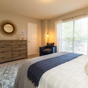 Renovated Bedroom with Large Picture Window at Arbors Harbor Town