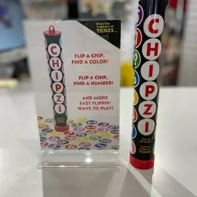 Welcome our new featured game Chipzi! By the makers of Tenzi, Chipzi is a fast-paced multiplayer game with 10 different ways to play! From flip a chip and find a color to finding pairs, it’s “fast flippin’ fun”! Now available at all of our stores.