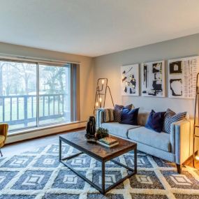 Living Room with Balcony at Audenn Apartments