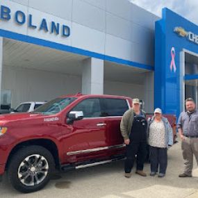 Red truck in front of Boland Chevrolet