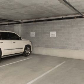 Reserved parking spaces in the garage at Camden Music Row apartments in Nashville, TN