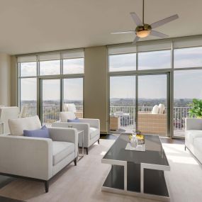 Camden Music Row Apartments Penthouse living room with floor-to-ceiling windows, large balcony with a view, ceiling fans, and hardwood-style flooring