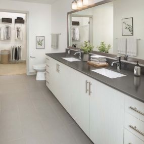 Bathroom with light cabinets and double sinks at Camden Music Row apartments in Nashville, TN