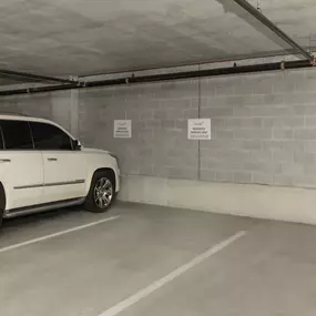 Reserved parking spaces in the garage at Camden Music Row apartments in Nashville, TN