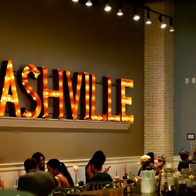 Local restaurant Biscuit Love with Nashville sign.