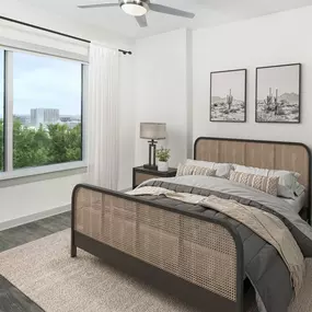 Bedroom with wood-style flooring and large window at Camden Music Row apartments in Nashville, TN