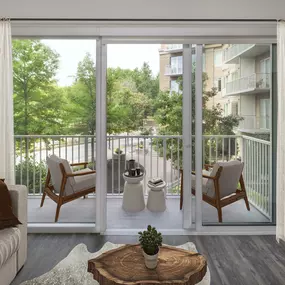 Living room with private balcony over the courtyard at Camden Music Row apartments in Nashville, TN