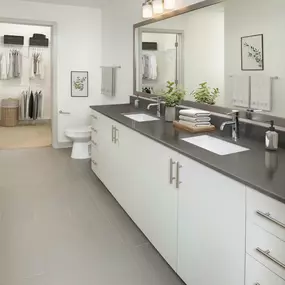 Bathroom with light cabinets and double sinks at Camden Music Row apartments in Nashville, TN