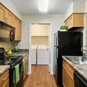 Gourmet Kitchens with G.E. Black Appliances and Maple Raised-Panel Cabinetry at Rosemont Apartments, Roswell, GA