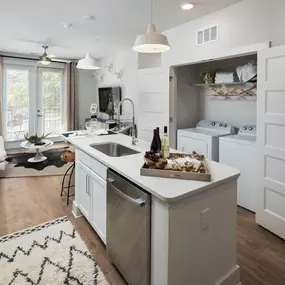 Open-Concept Kitchens with Quartz Countertops and Classic Shaker Cabinets at Echo at North Pointe Center Apartment Homes