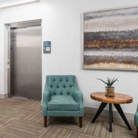 Elevator lobby with seating at Camden Greenville