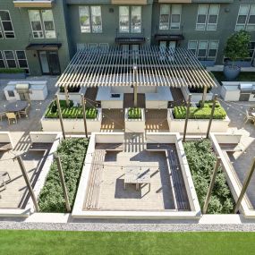 Aerial view of outdoor courtyard with seating and grill area at Camden Greenville