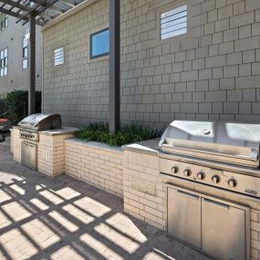 Poolside grills at the Villas pool at Camden Greenville apartments in Dallas, TX