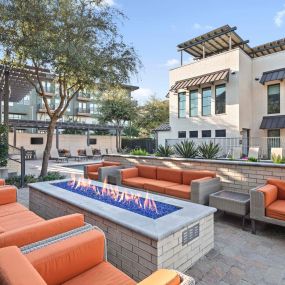 Villas side poolside firepit with seating at Camden Greenville