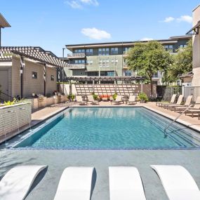 Resort-style pool and sundeck on the Villas side at Camden Greenville apartments in Dallas, TX