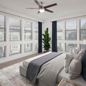 Villas townhome bedroom with carpet and large windows at Camden Greenville