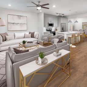 Villas townhome living room, dining room and kitchen with wood-style flooring and gray cabinets at Camden Greenville
