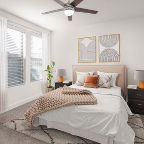 Flats bedroom with carpet and ceiling fan at Camden Greenville