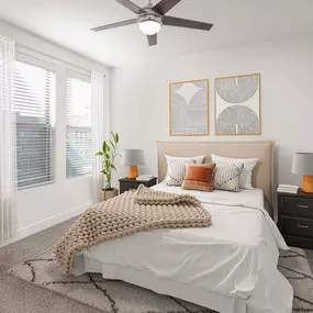 Flats bedroom with carpet and ceiling fan at Camden Greenville