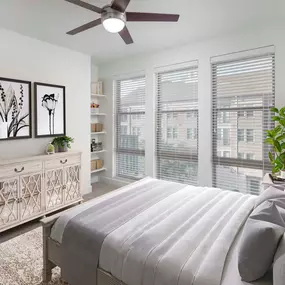 Flats bedroom with carpet and built-in shelves at Camden Greenville