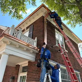 Gutter installation on two story house