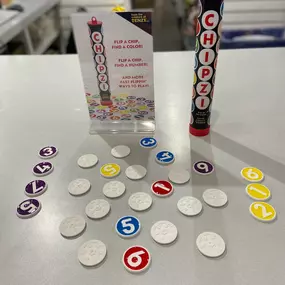 Welcome our new featured game Chipzi! By the makers of Tenzi, Chipzi is a fast-paced multiplayer game with 10 different ways to play! From flip a chip and find a color to finding pairs, it’s “fast flippin’ fun”! Now available at all of our stores.