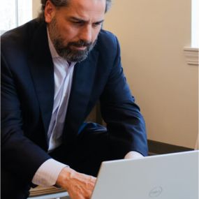 Vince Capuano Typing on Computer