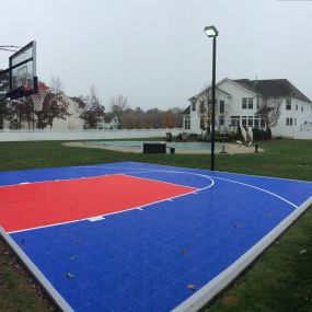 30′ x 30′ SnapSports DuraCourt Basketball Court Surface -Have a smaller space but still want the excitement of your own basketball court in your backyard, the SnapSports 30′ x 30′ is our most popular smaller court size.  This court features our DuraCourt outdoor surface with half court basketball lines.  Simply shooting around, a game of horse or pick up games with the kids, this basketball surface will provide a safe and attractive place to play.  With 19 colors  from which to choose your team 