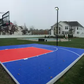 30′ x 30′ SnapSports DuraCourt Basketball Court Surface -Have a smaller space but still want the excitement of your own basketball court in your backyard, the SnapSports 30′ x 30′ is our most popular smaller court size.  This court features our DuraCourt outdoor surface with half court basketball lines.  Simply shooting around, a game of horse or pick up games with the kids, this basketball surface will provide a safe and attractive place to play.  With 19 colors  from which to choose your team 