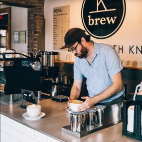 K Brew Barista at front counter