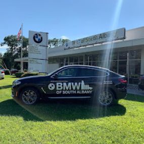Black BMW In front of BMW of South Albany showroom