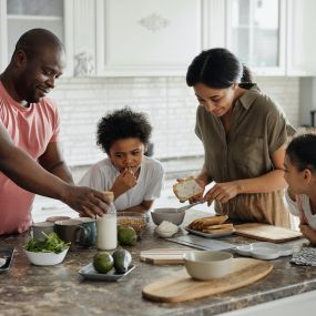 A family enjoying freshly refinished cabinets in  Brierwood Hills, IN