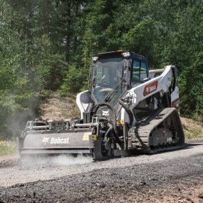 A tracked Bobcat T86 with planer attachment