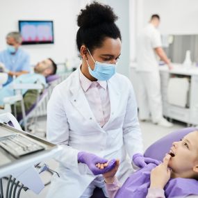 young girl with pediatric dentist