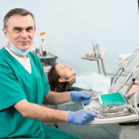 Pediatric dentist with his patient