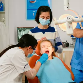 Pediatric dentist in Ogden working with a patient