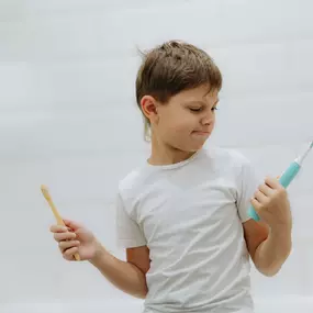 boy holding a toothbrush