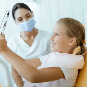 Young girl sitting at a pediatric office