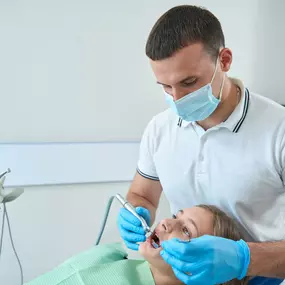 Pediatric dentist with a patient