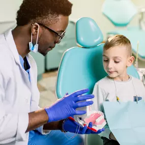 Pediatric dentist with a young patient