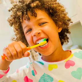 Young boy brushing teeth