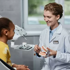 pediatric dentist with patient