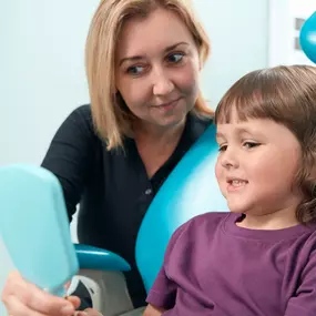 Pediatric dentist with patient