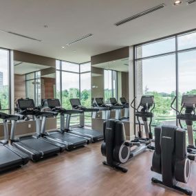 Two-story fitness center with cardio equipment and incredible views