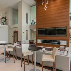 Resident lounge with fireplace and televisions