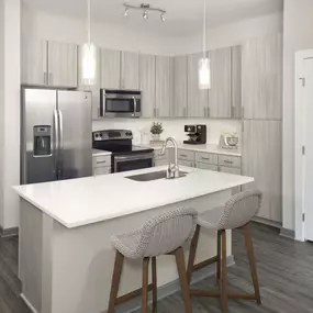 Kitchen with light finish and island counter at Camden Franklin Park