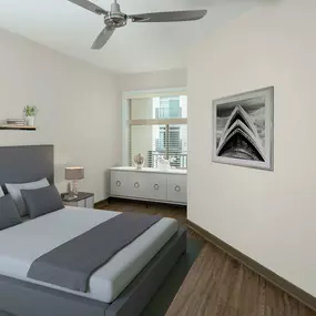 Bedroom with wood-style flooring.