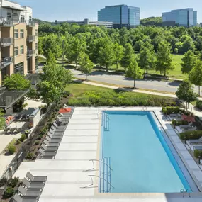 View of resort-style pool and sundeck looking toward Franklin business park near Camden Franklin Park apartments in Franklin, TN