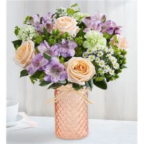 EXCLUSIVE The rustic charm of a country garden is beautifully showcased in our new bouquet. Loosely gathered, the mix of peach and lavender blooms is designed in our new peach quartz mason jar. This artfully textured vase features a sweet honeycomb pattern and is finished with a raffia bow, creating the perfect complement of color. For the big celebrations and small, everyday moments, it’s a gift that delivers warmth and brightness to the people you hold dear.
