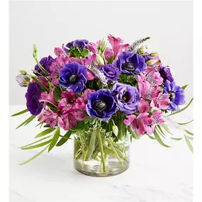 Purple is such a regal color, and they’ll feel like royalty when they receive this eye-catching bouquet. Anemones, veronicas, Peruvian lilies, and more blooms in a variety of purple hues are artfully arranged for maximum drama and impact.